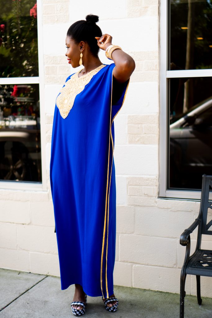 How to Wear an African Boubou, tips featured by top Atlanta fashion blogger, Hurry in Time: lady in blue boubou dress outside with her hand behind her head