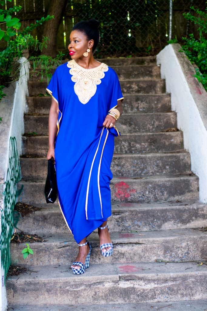 How to Wear an African Boubou, tips featured by top Atlanta fashion blogger, Hurry in Time: lady in blue boubou dress walking down on stairs outside