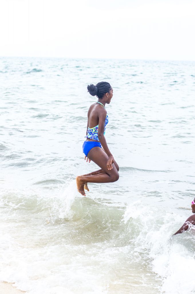 girl on the beach jumping
