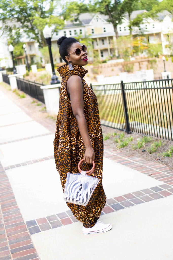 Herem Jumpsuit styled by top Atlanta fashion blogger, Hurry in Time: A woman wearing a leopard jumpsuit standing outside