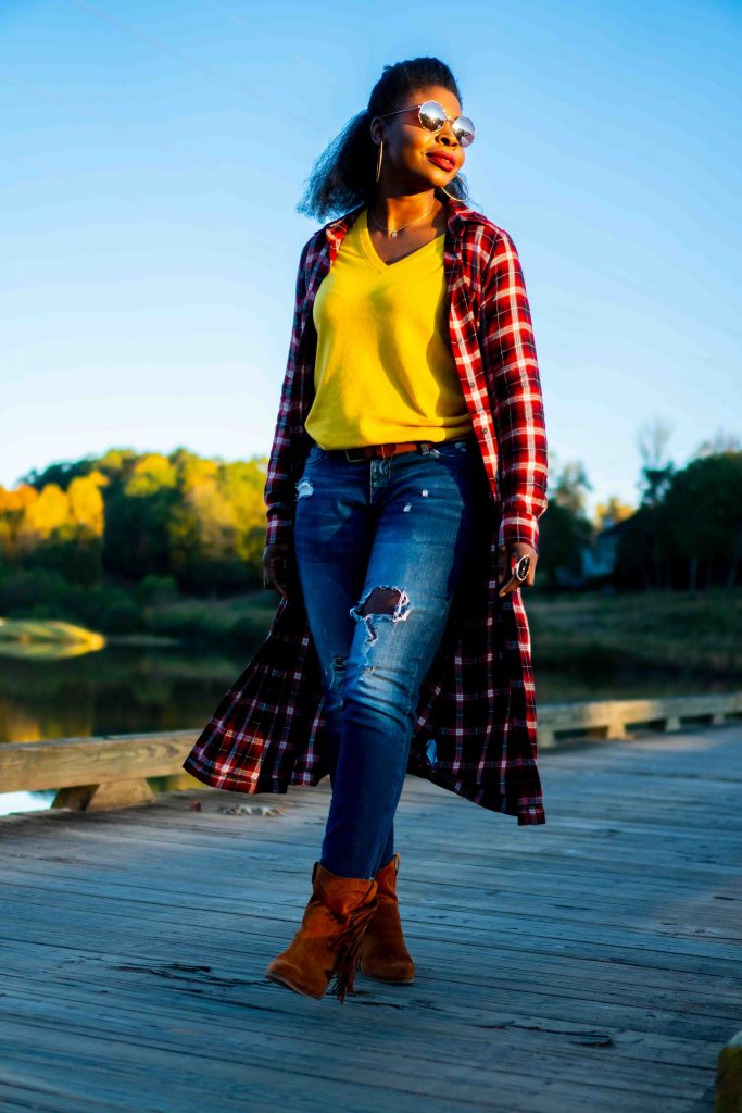 How to Address Family Nostalgia During the Holidays, tips featured by top Atlanta lifestyle blogger, Hurry in Time: Woman standing on a board walk in a red plaid dress over jeans.