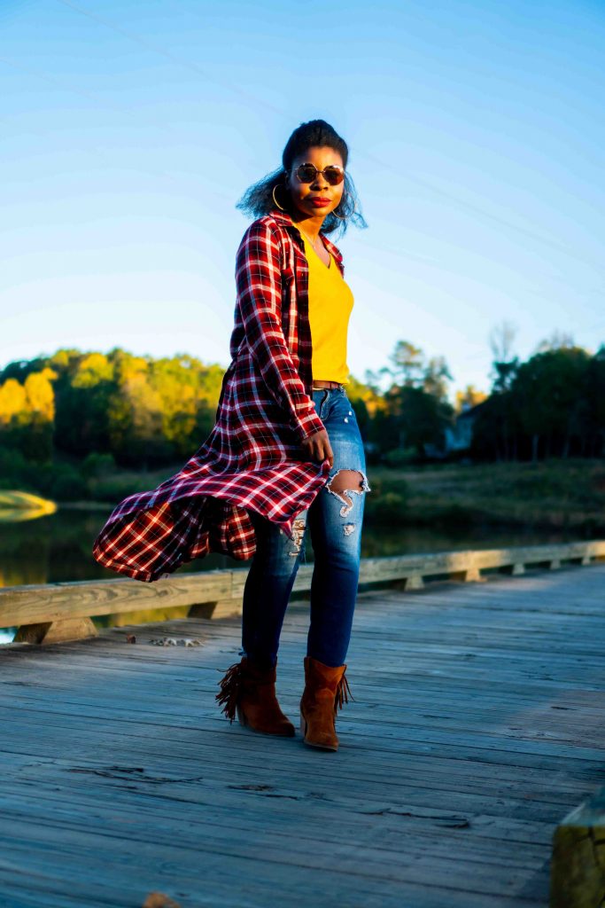 How to Address Family Nostalgia During the Holidays, tips featured by top Atlanta lifestyle blogger, Hurry in Time: Woman standing on a bridge in a red plaid dress over jeans.