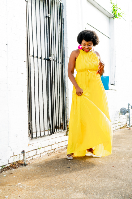 Yellow Pleated Dress styled for Summer by top Atlanta fashion blogger, Hurry in Time: Woman wearing a yellow dress standing outside