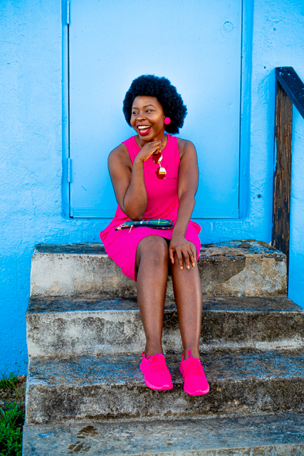 Pink Summer Knit Dress featured by top Atlanta fashion blogger, Hurry in Time: woman in a pink outfit sitting on steps outside smiling