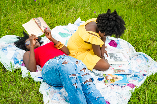 How to Teach Kids About Racism: 5 Effective Ways featured by top Atlanta lifestyle blogger, Hurry in Time: Mother lying on a blanket reading with her daughter