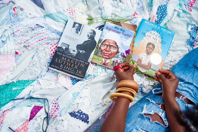 ATeaching Kids About Black History, Equality and About Racism: 5 Effective Ways featured by top Atlanta lifestyle blogger, Hurry in Time: frican American books on a blanket