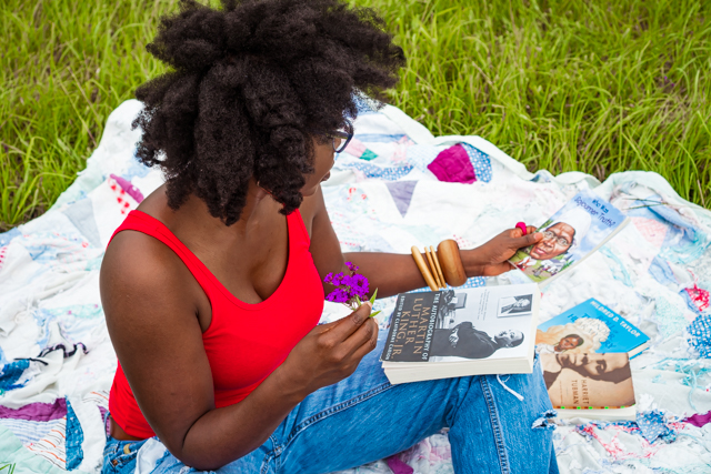Teaching Kids About Black History, Equality and About Racism: 5 Effective Ways featured by top Atlanta lifestyle blogger, Hurry in Time: woman sitting on a blanket in a grass field
