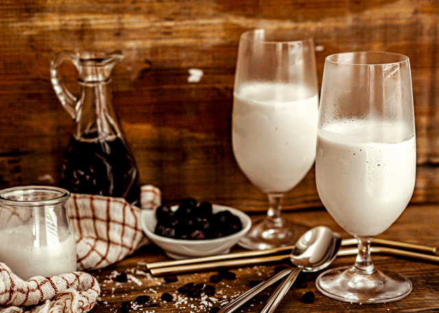 Keto Sea Salt Caramel Coffee Milkshake Recipe featured by top Atlanta lifestyle blogger, Hurry in Time: ice cream shake sitting on a table with coffee and milk